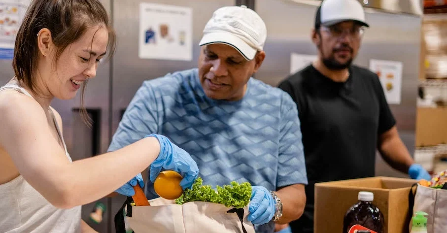 Volunteers packing food