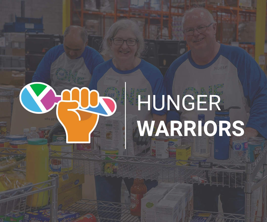 Volunteers in warehouse with Hunger Warriors logo superimposed over image